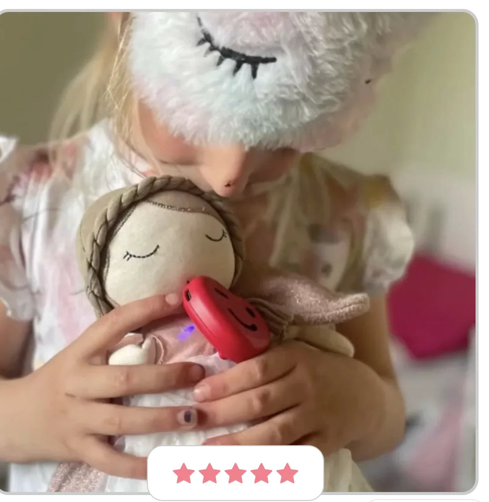 Child cuddling a soft toy with the red ToyPal One heart attached
