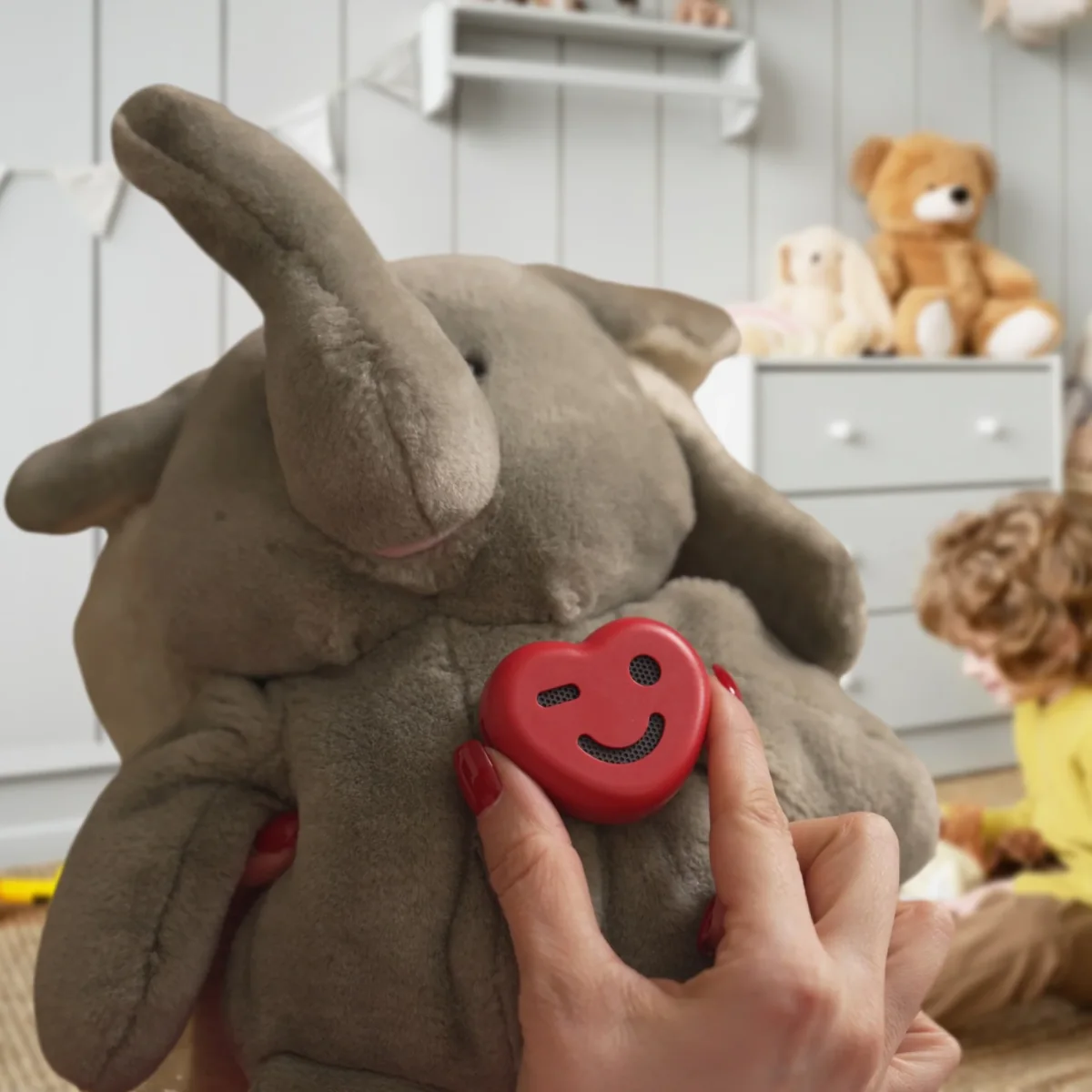 ToyPal One being attached securely to a soft elephant toy