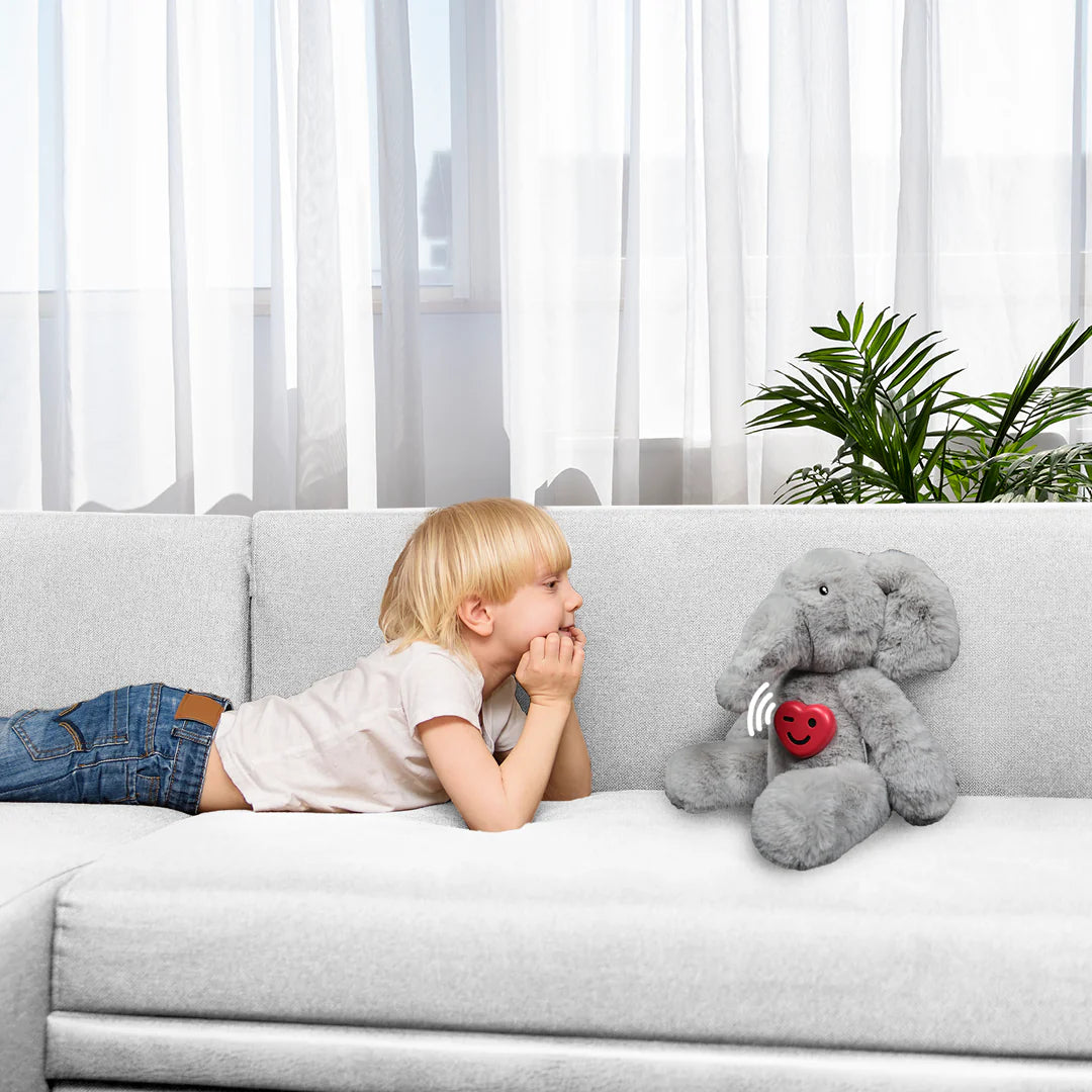 A child listening to a story through a soft toy fitted with ToyPal One